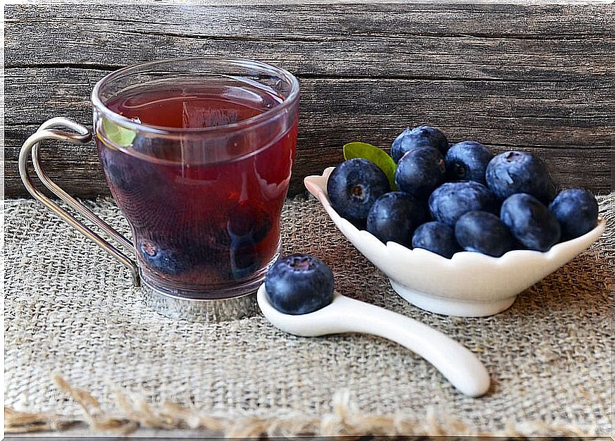 Cup with cranberry juice.