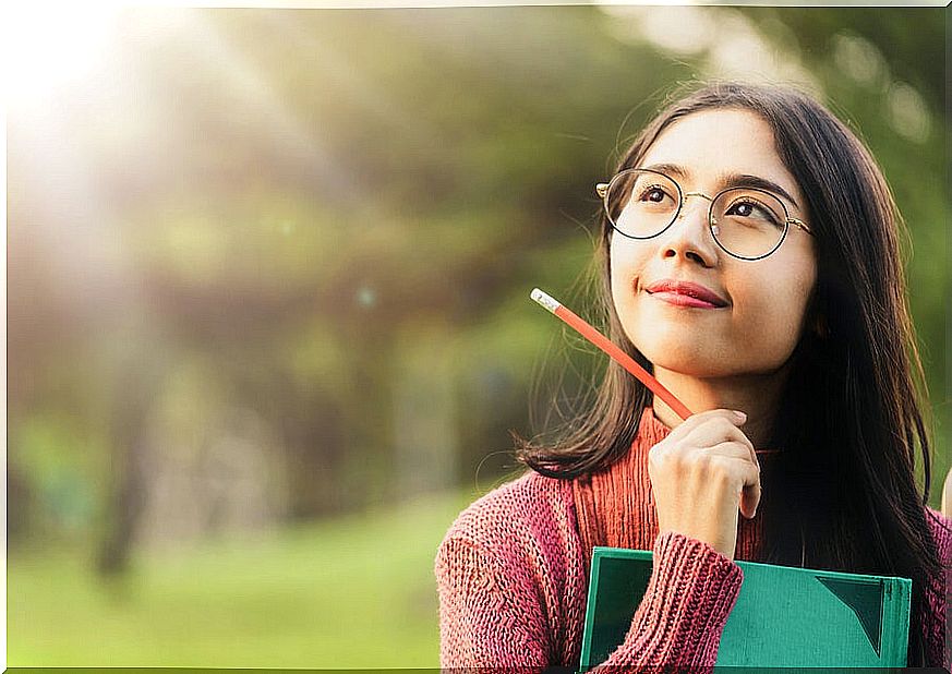 Girl with glasses thinking.