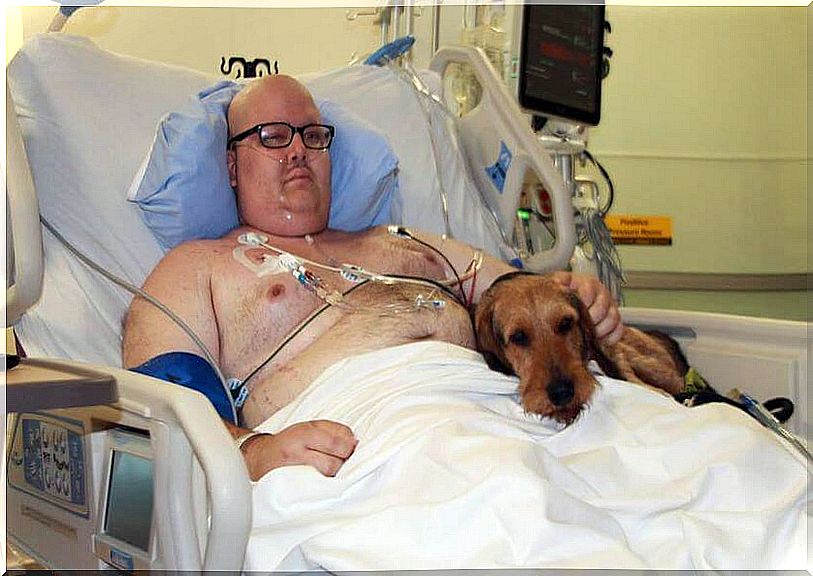 Man with his dog in hospital