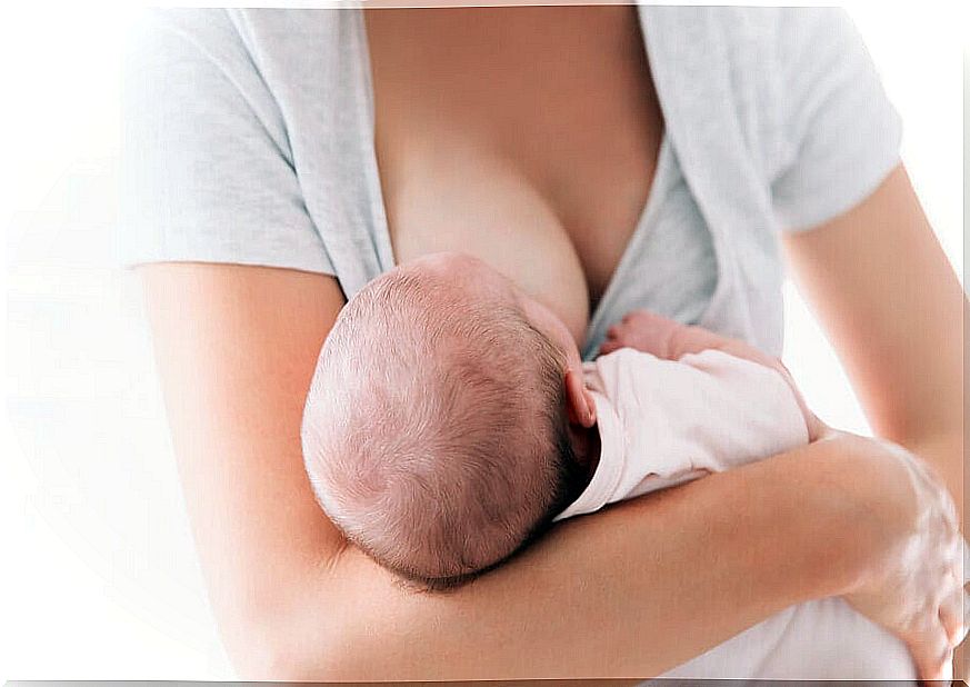 Woman breastfeeds her baby.