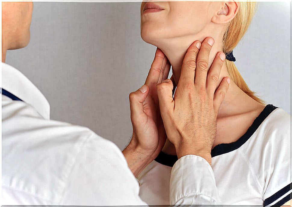 Doctor palpating nodules on the neck.
